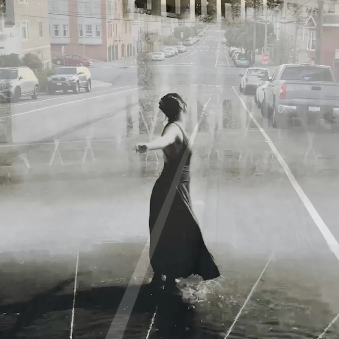 A layered street scene with a figure in a black dress