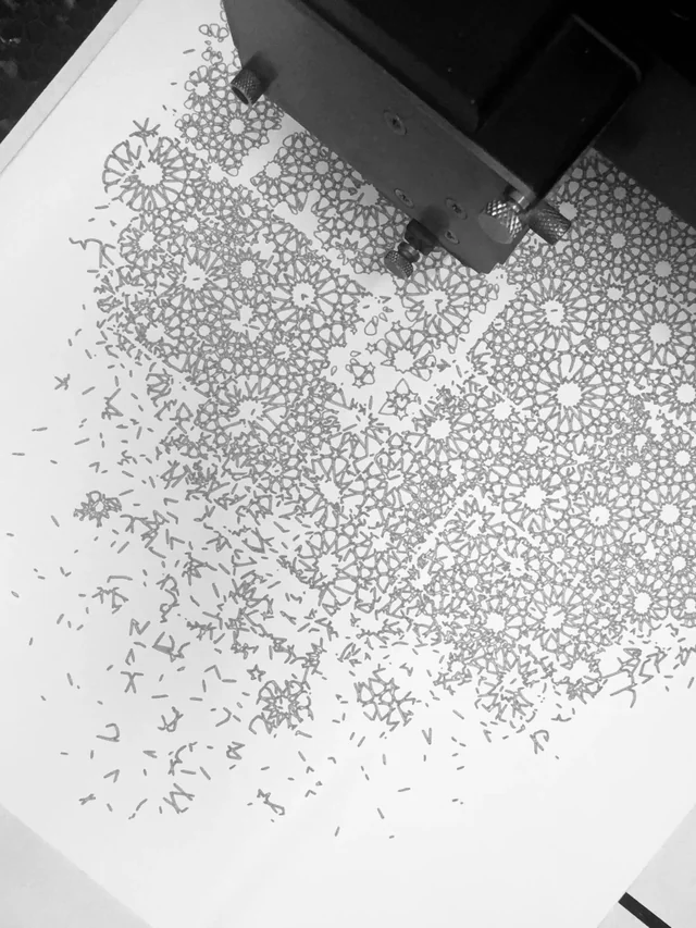Plotter drawing a rosette pattern