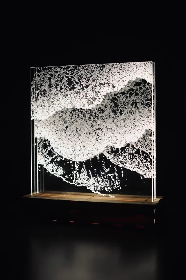 Illuminated layered text artwork against a dark background