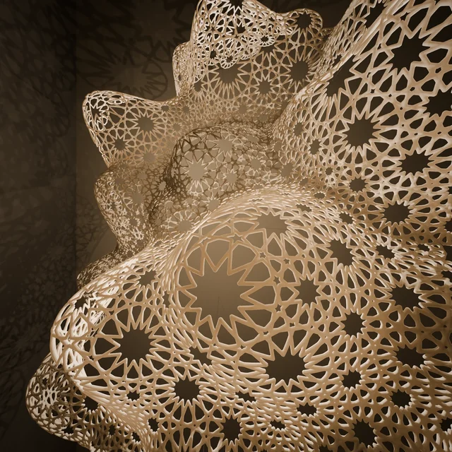 Warmly lit rosette-patterned sculptural surface casting shadows