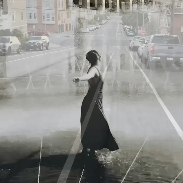 Layered street scene with a figure in a black dress, from trace logs of the heart