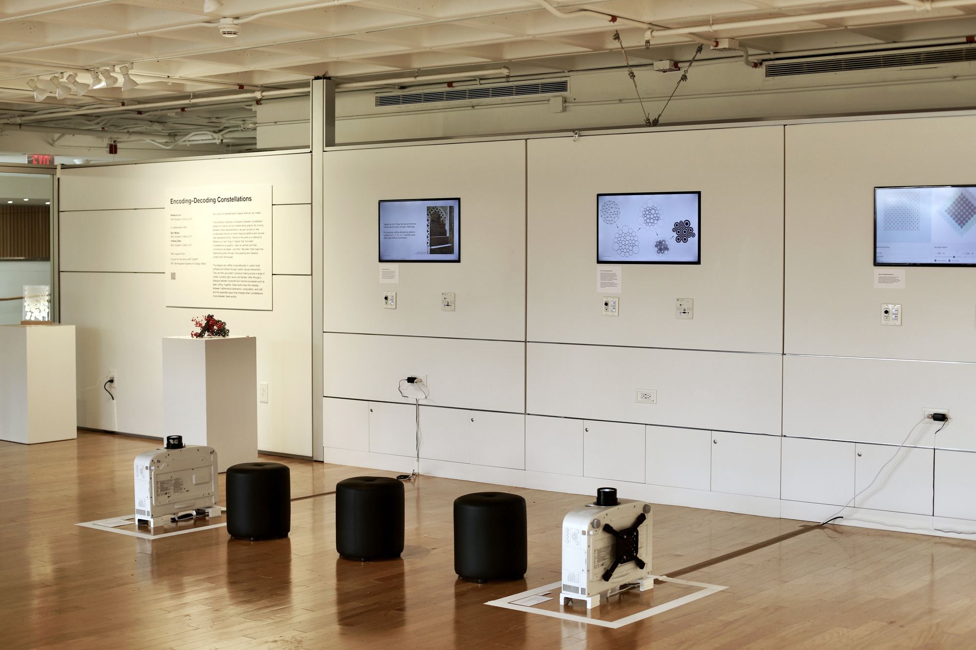 Gallery exhibition view showing left wall with artwork installations